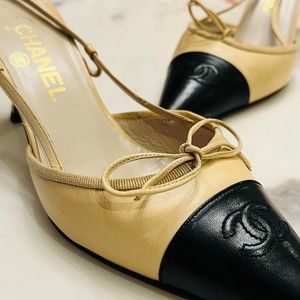 CHANEL Beige/Black Leather Bow CC Cap Toe Slingback Heels - Size 38 & 38.5